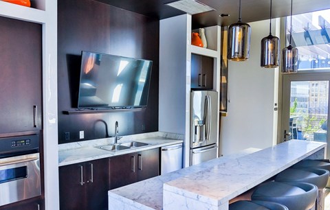Kitchen with dark wooden cabinets at Arcade Apartments, St Louis, MO