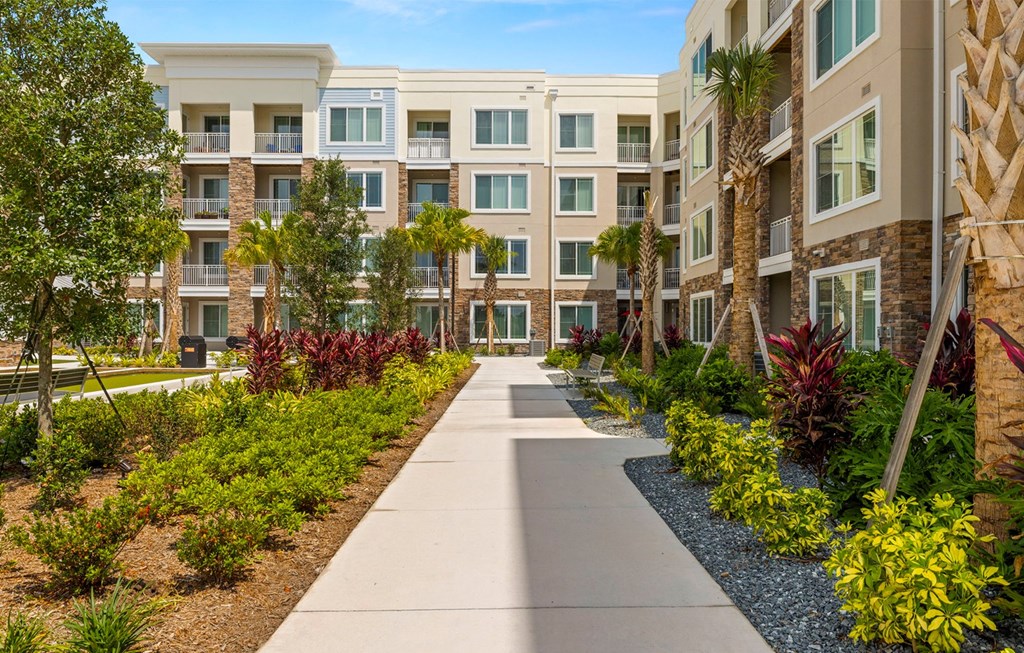 Exterior Walking Path at Osprey Park 62+ Apartments, Kissimmee, FL, 34758