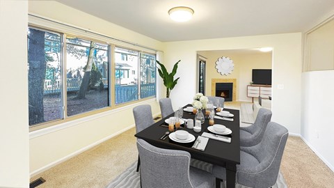 Formal dining room in Weatherstone Townhome with full window wall and easy access to kitchen.