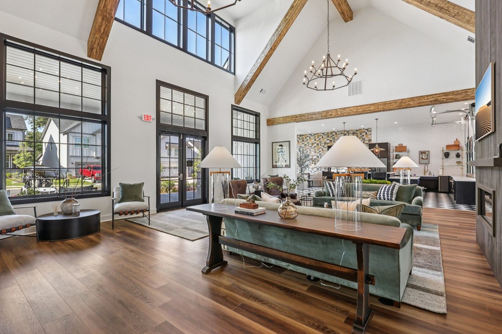 A large room with a long table and chairs.