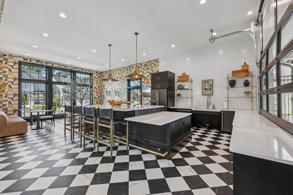 A black and white checkered floor in a modern kitchen.
