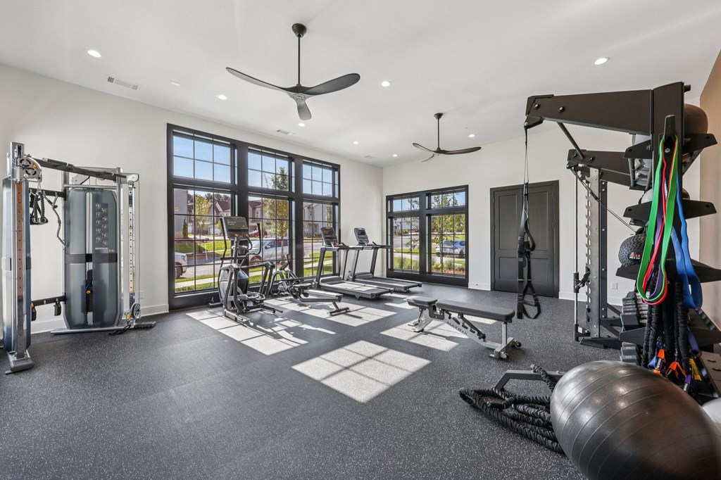 A spacious home gym with a variety of exercise equipment.