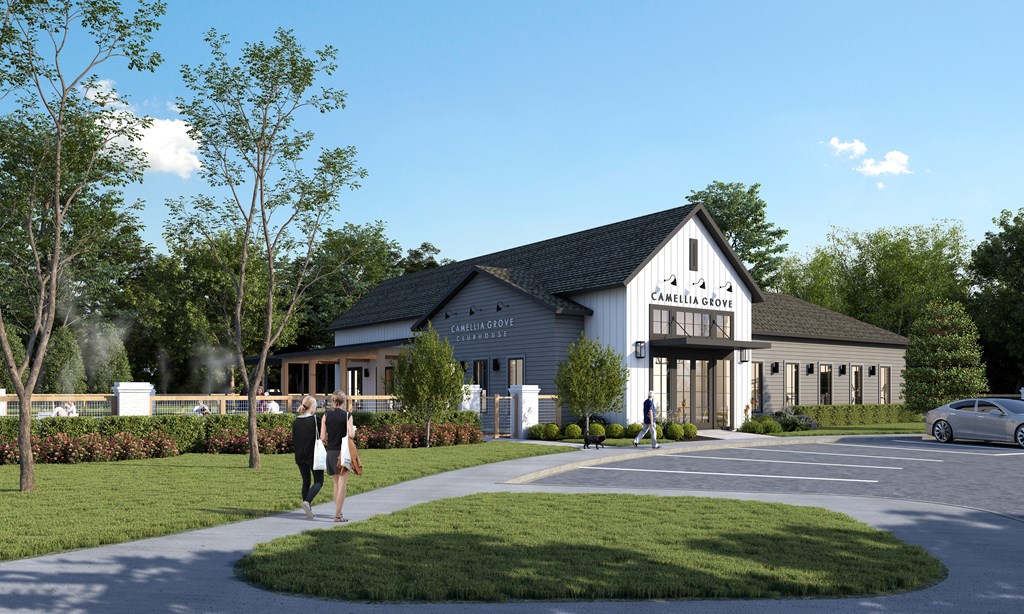 A modern building with a black roof and white walls with people walking in front.