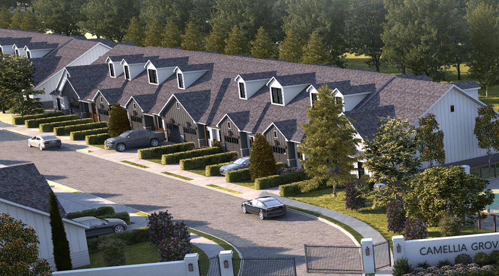 A street view of a residential area with houses and cars.