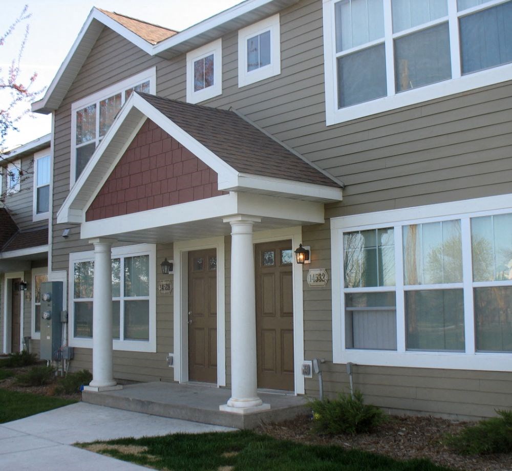 the front of a house with a porch