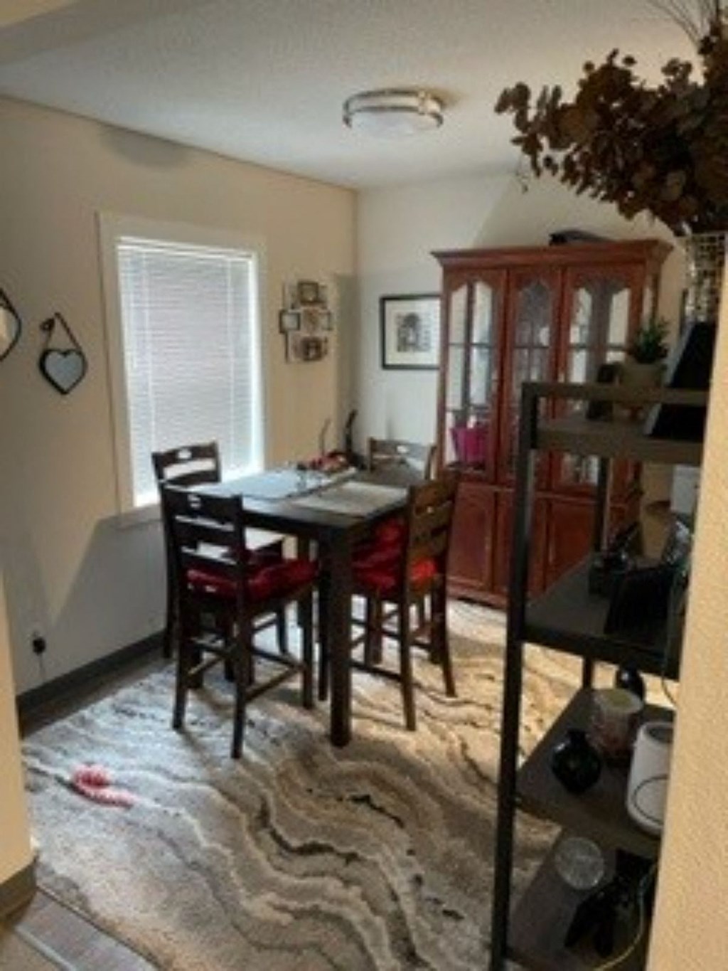 a dining room with a table and chairs