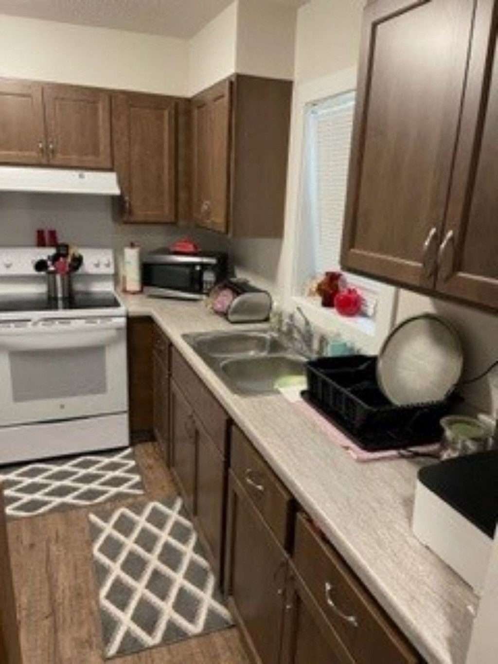 a kitchen with a stove and a sink