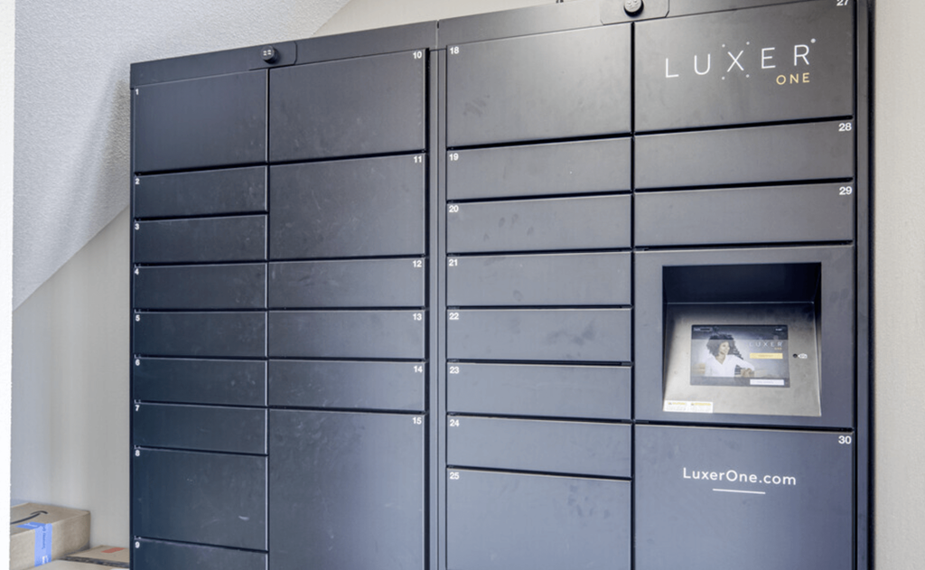 the lockers in the storage room are black and have a photo on the door