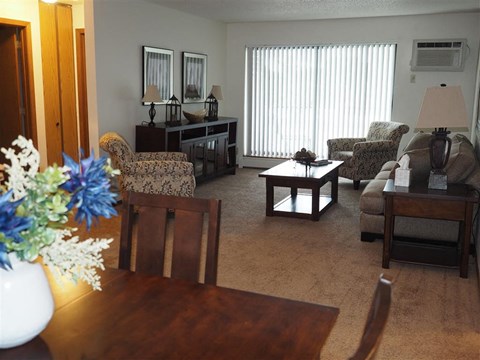 a living room filled with furniture and a table