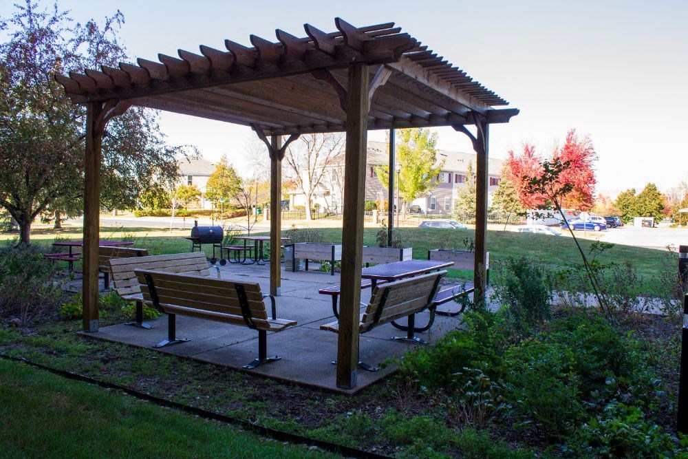 a picnic area with benches and a pavilion