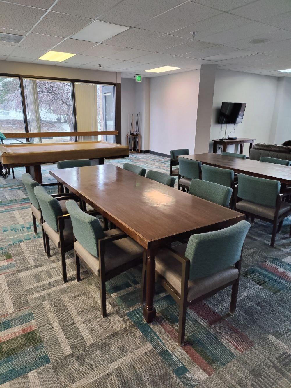 a conference room with a table and chairs