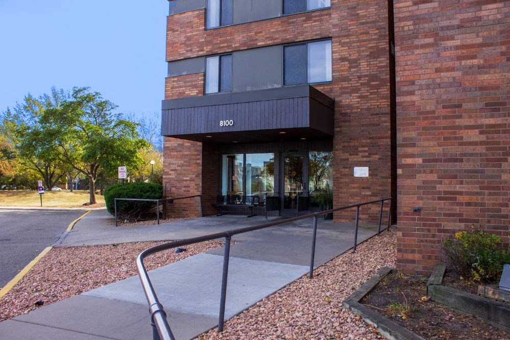 the front of a building with a ramp in front of it