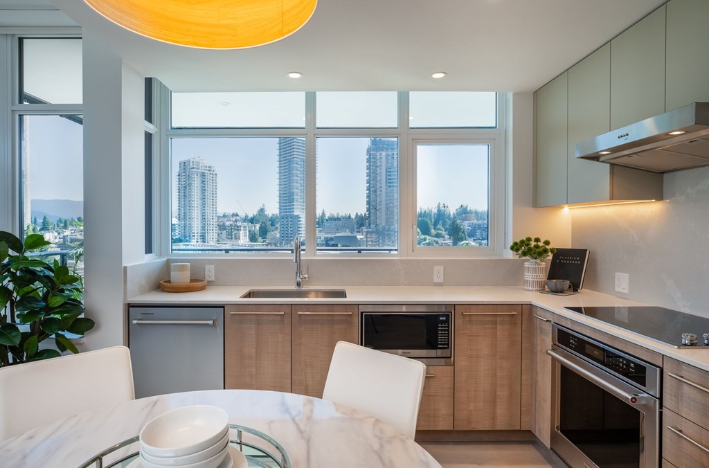 A modern kitchen with a view of the city.