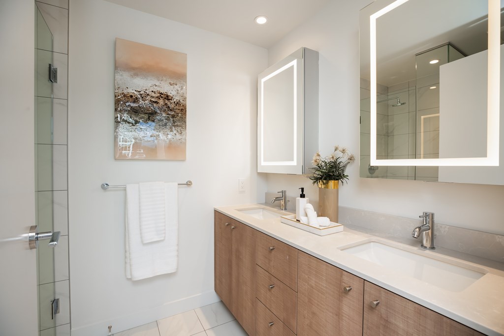 A bathroom with a white towel hanging on the wall.