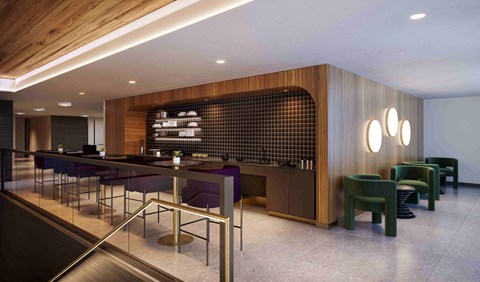 A modern dining area with a long table and chairs.