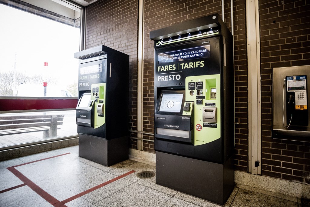 A row of three kiosks for bus, train and metro fares.