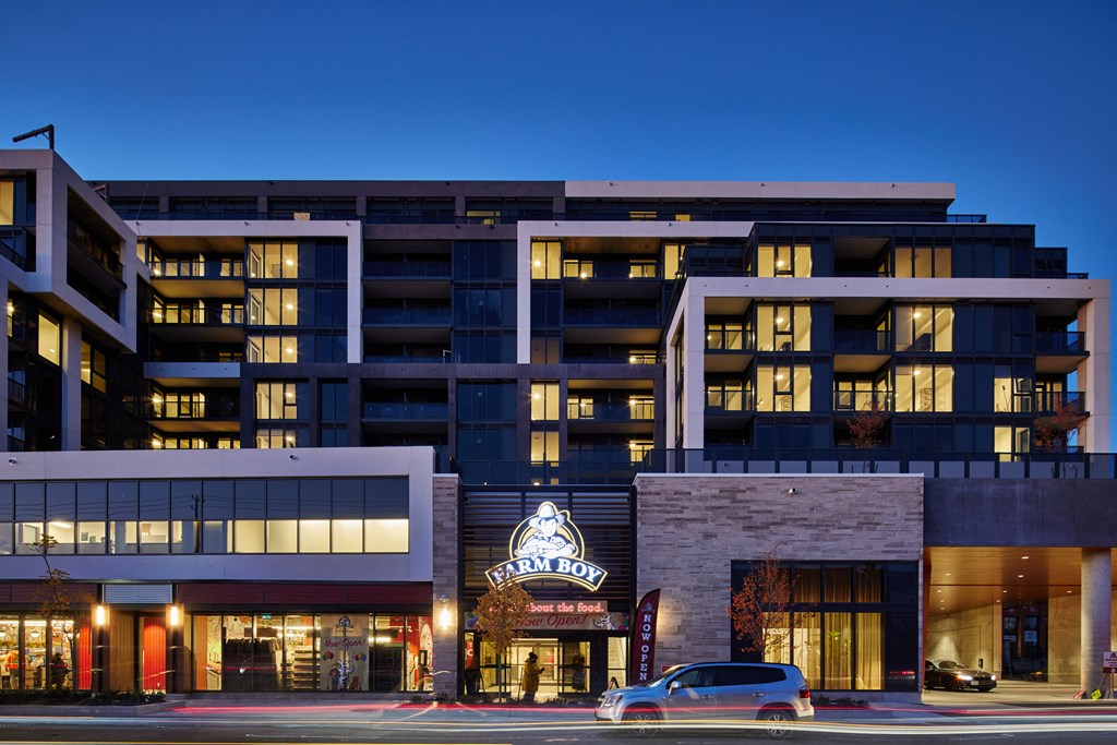 A building with a Farm Boy sign in front of it.