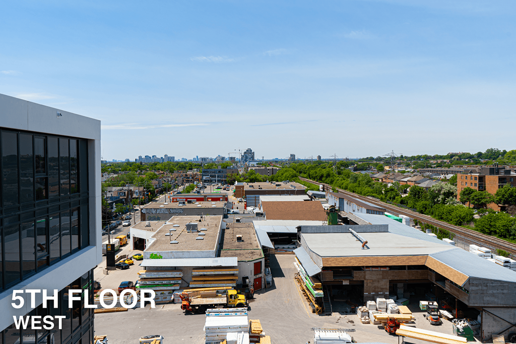A view of a construction site from the 5th floor of a building.