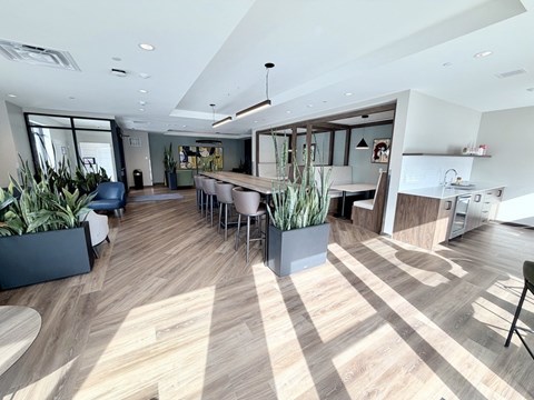 A modern office space with wooden floors and furniture.