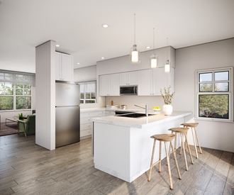 a kitchen with white cabinets and a white island with three stools