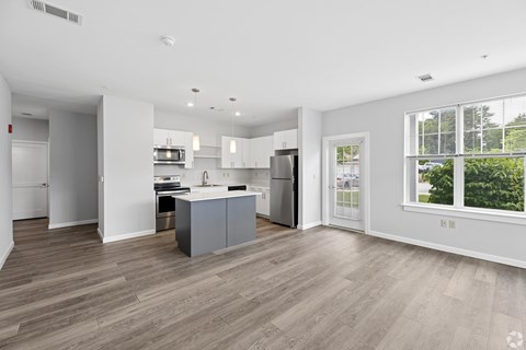 A spacious kitchen with a large island and modern appliances.