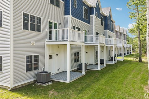 A row of houses with white and blue siding.