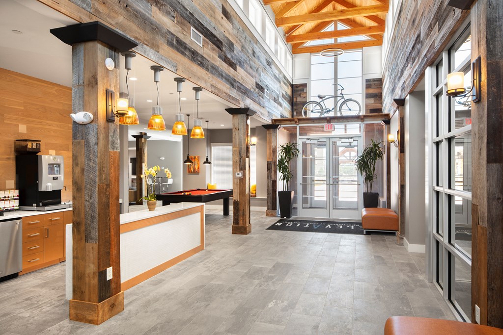 the lobby of an office building with a lobby area with a desk and a chair