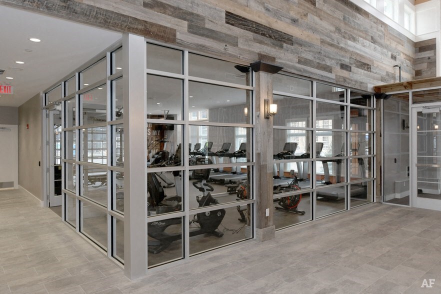 a large display case in a room with glass doors