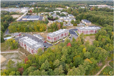 An aerial view of a campus with buildings and trees.