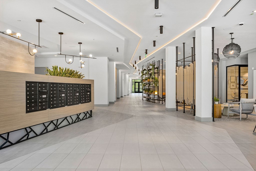 A long hallway with a blackboard on the wall.