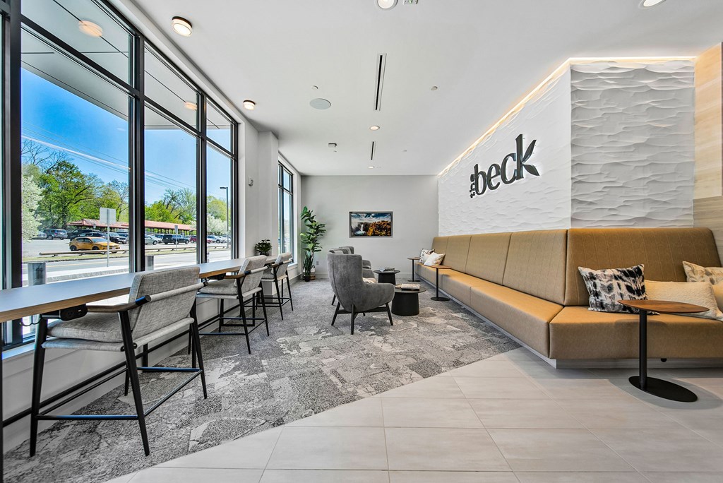A Beck store interior with a row of chairs and a bench.