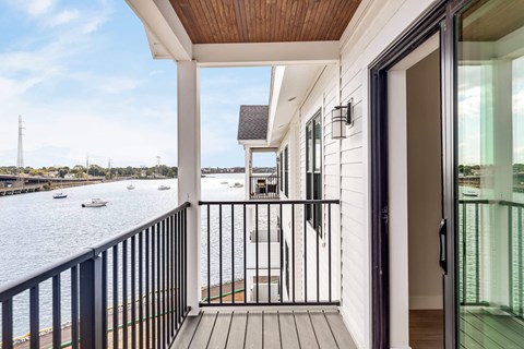 a view of the river from the balcony of a home