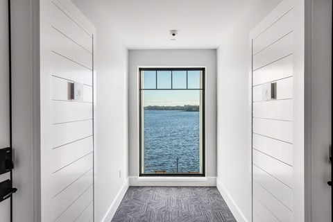 a view of the water from a room with a window