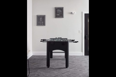 a table in a room with a game controller on it