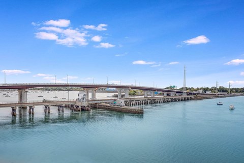 a view of a bridge over a body of water