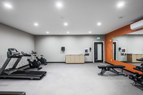 the gym with treadmills and other exercise equipment at the flats at west end