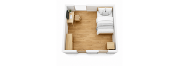 A bedroom with a bed, desk, and chair.