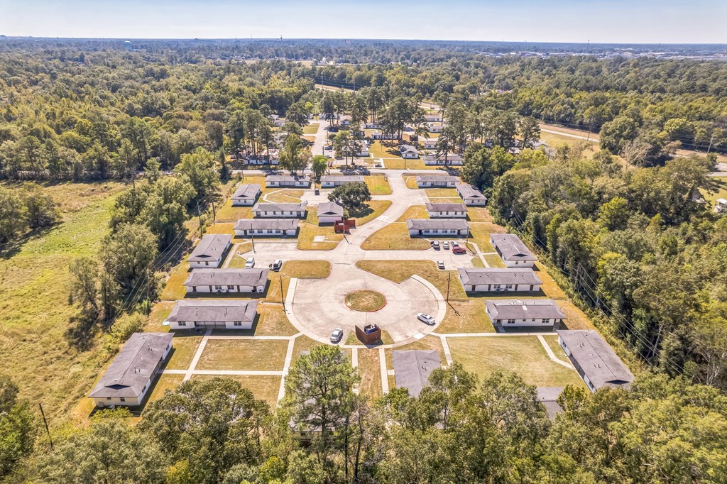 A bird's eye view of a large property with multiple buildings and a central courtyard.