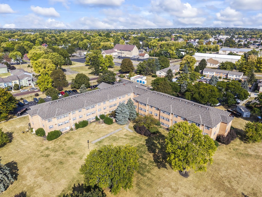 A large building with a grassy area in front of it.