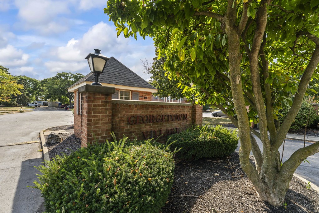 A small building with a sign that says Grove Town.