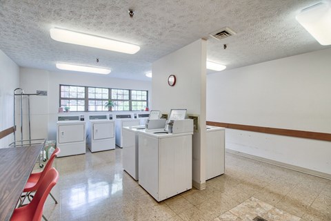 A room with a white wall and a brown stripe on the side.