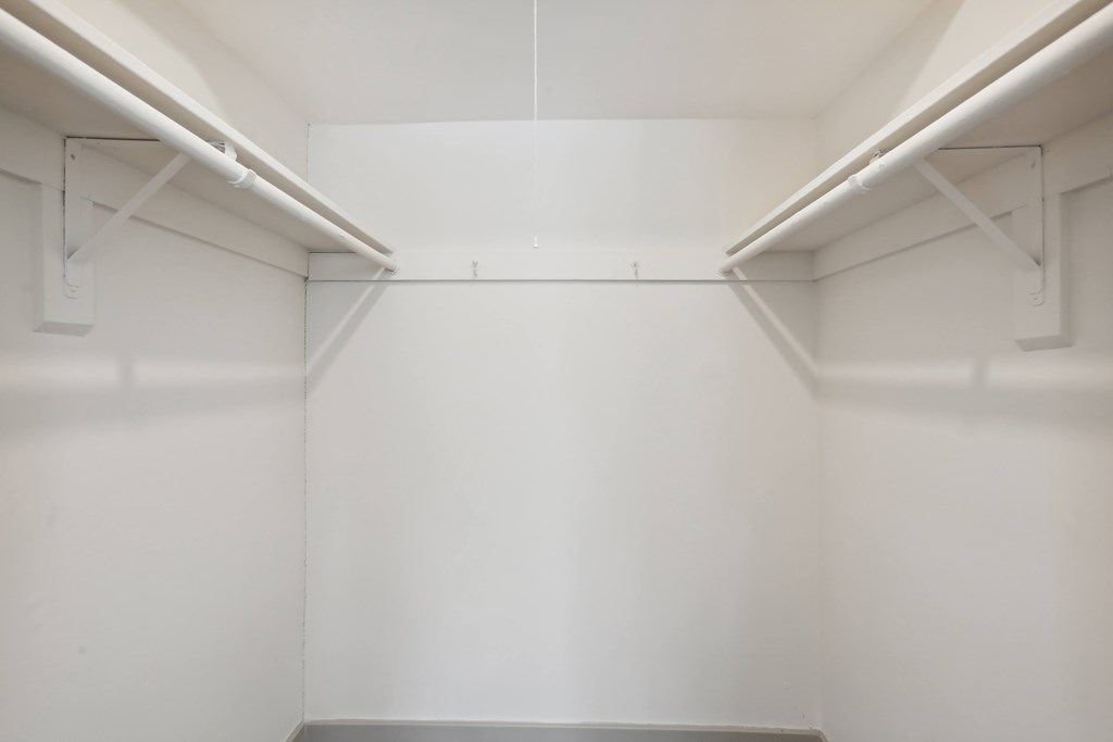 A white room with a grey floor and white walls.