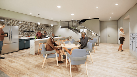 A group of people are gathered in a modern kitchen and dining area.