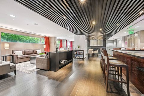 a living room with a kitchen and a dining room