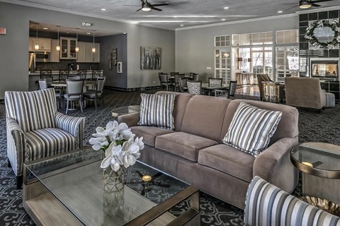 a living room with a couch and a glass table