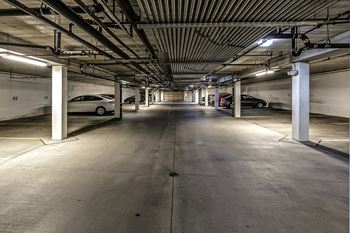 a parking garage with cars in it