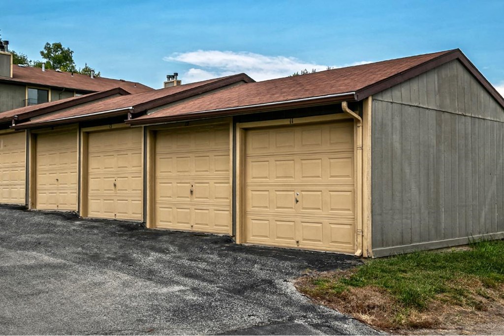 a row of garage doors on the side of a building