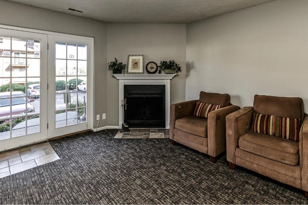 a living room with two couches and a fireplace