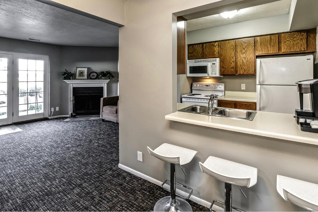 a kitchen with a sink and a refrigerator