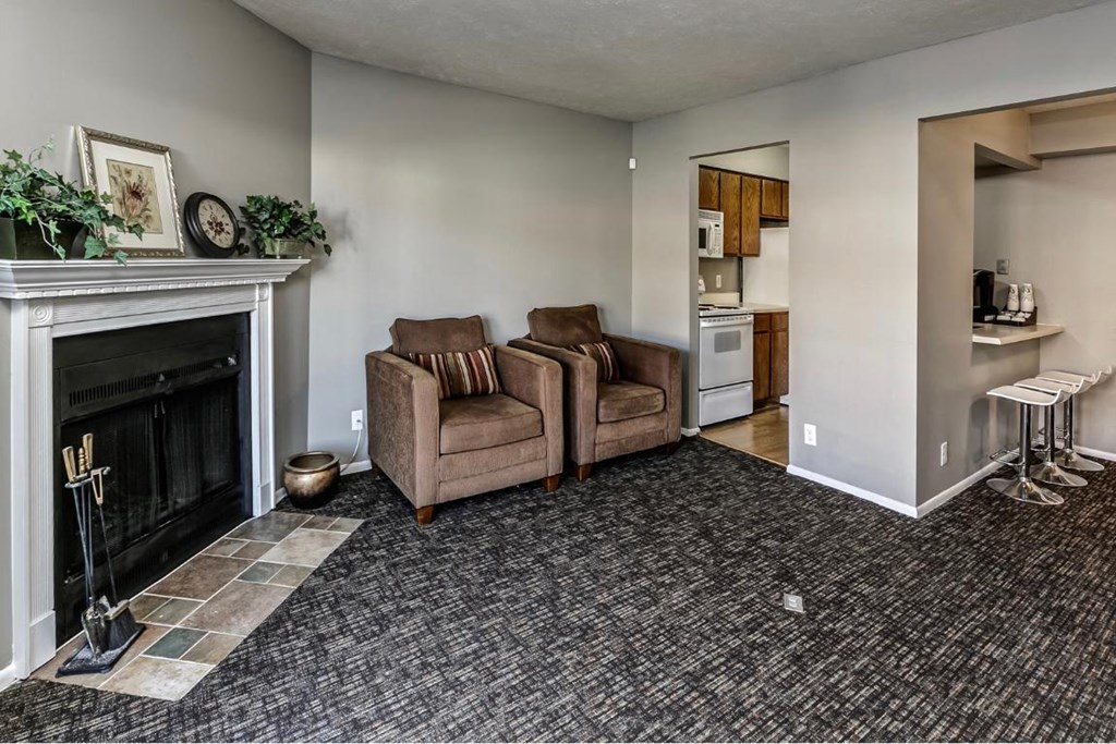 a living room with a fireplace and a couch